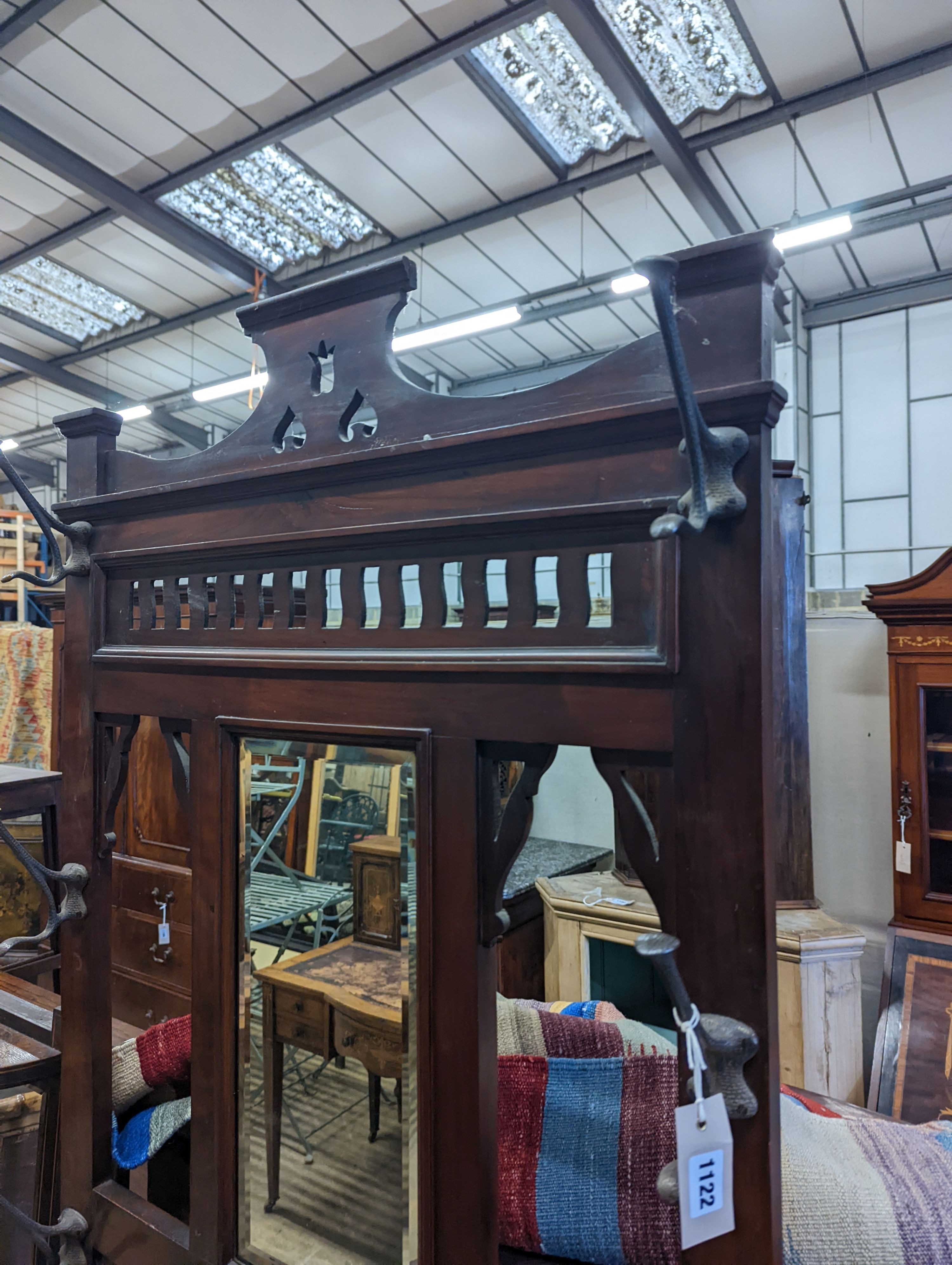 A late Victorian walnut hallstand, length 75cm, depth 30cm, height 203cm